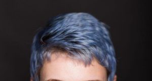 Rhiannon's headshot. Blue hair!